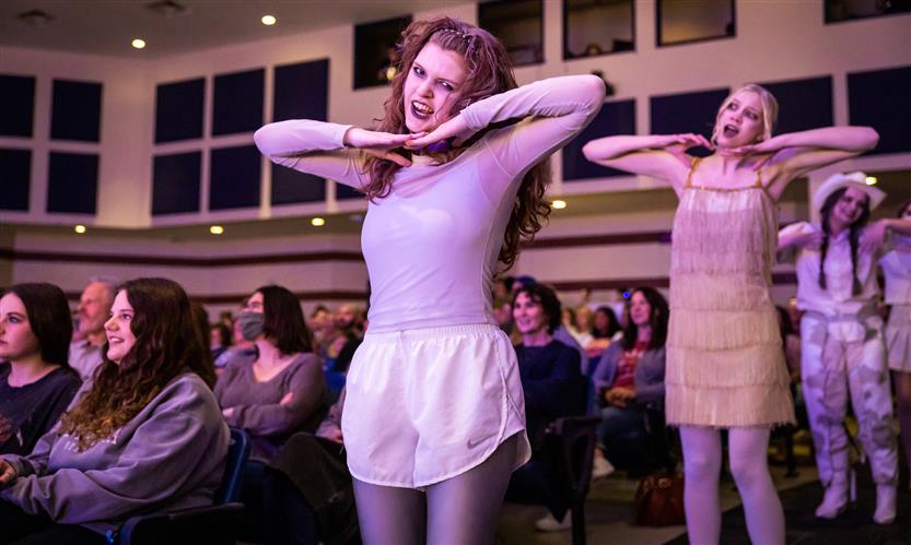 Students perform onstage
